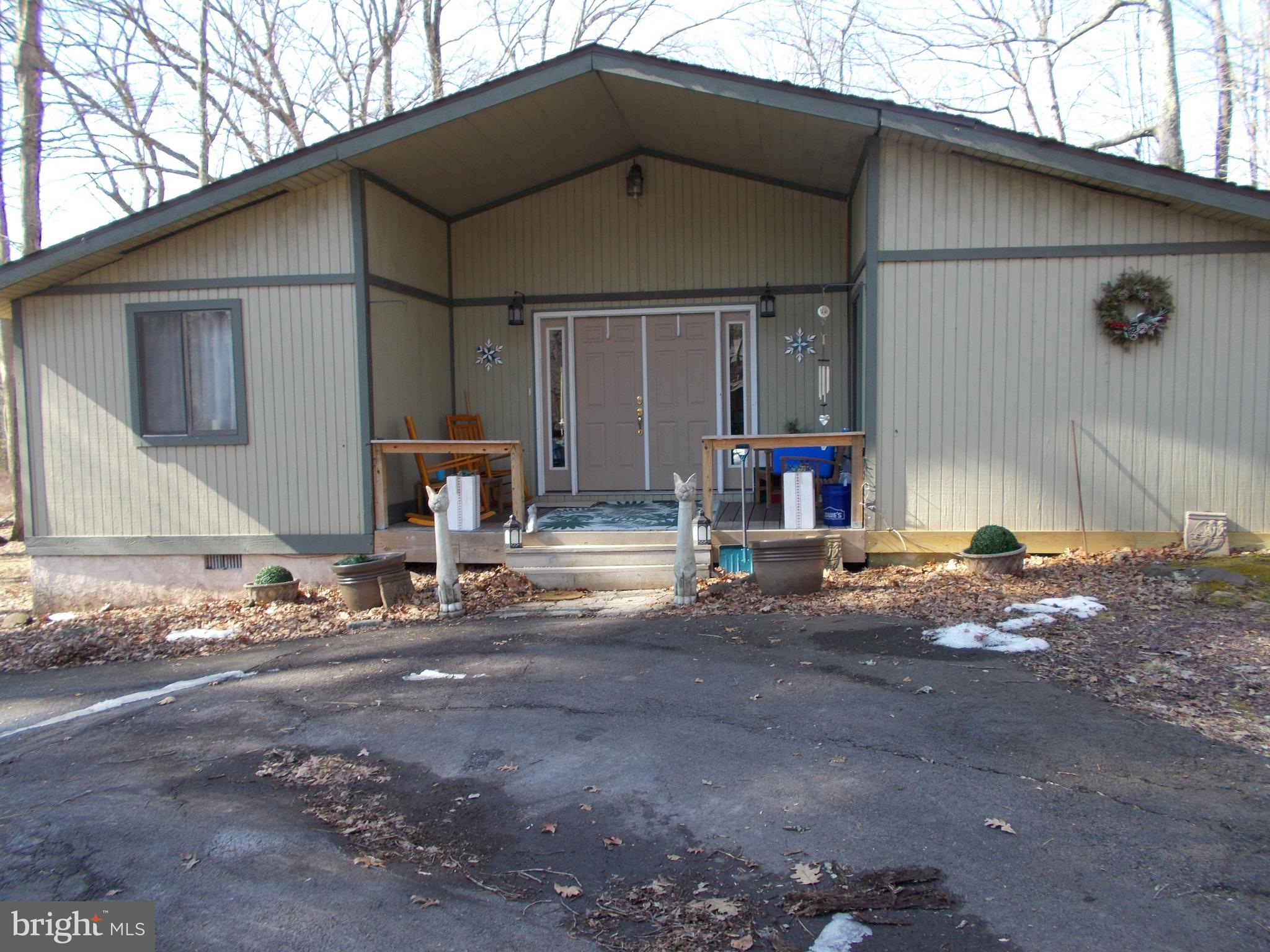 a front view of a house with parking