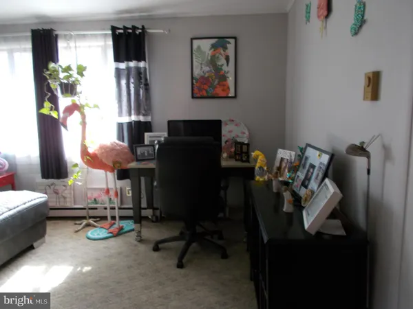 a view of a workspace with furniture