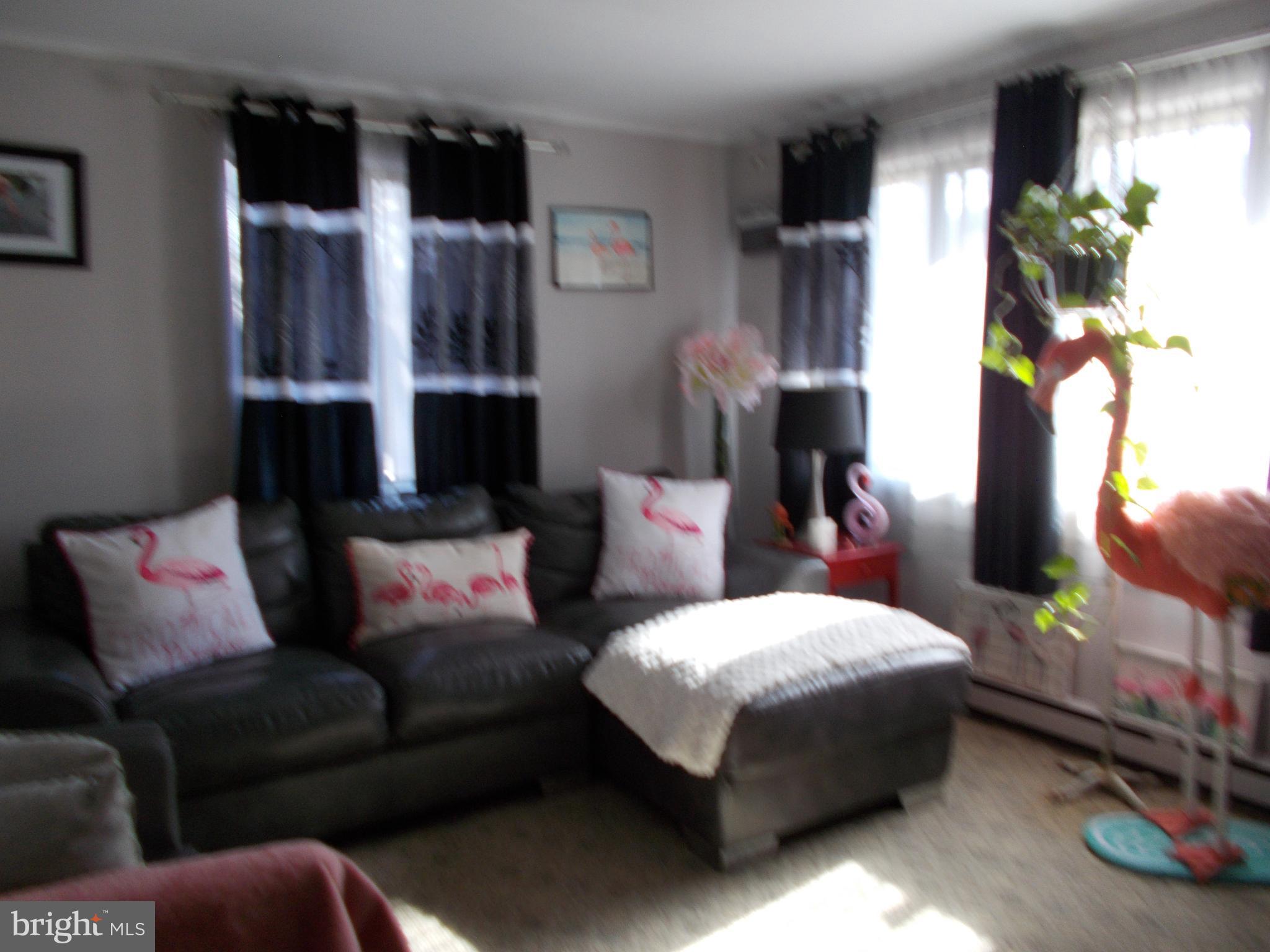 6 Cheyenne Drive Hazleton, PA 18202 - Photo 17 of 20 a living room with furniture and a lamp