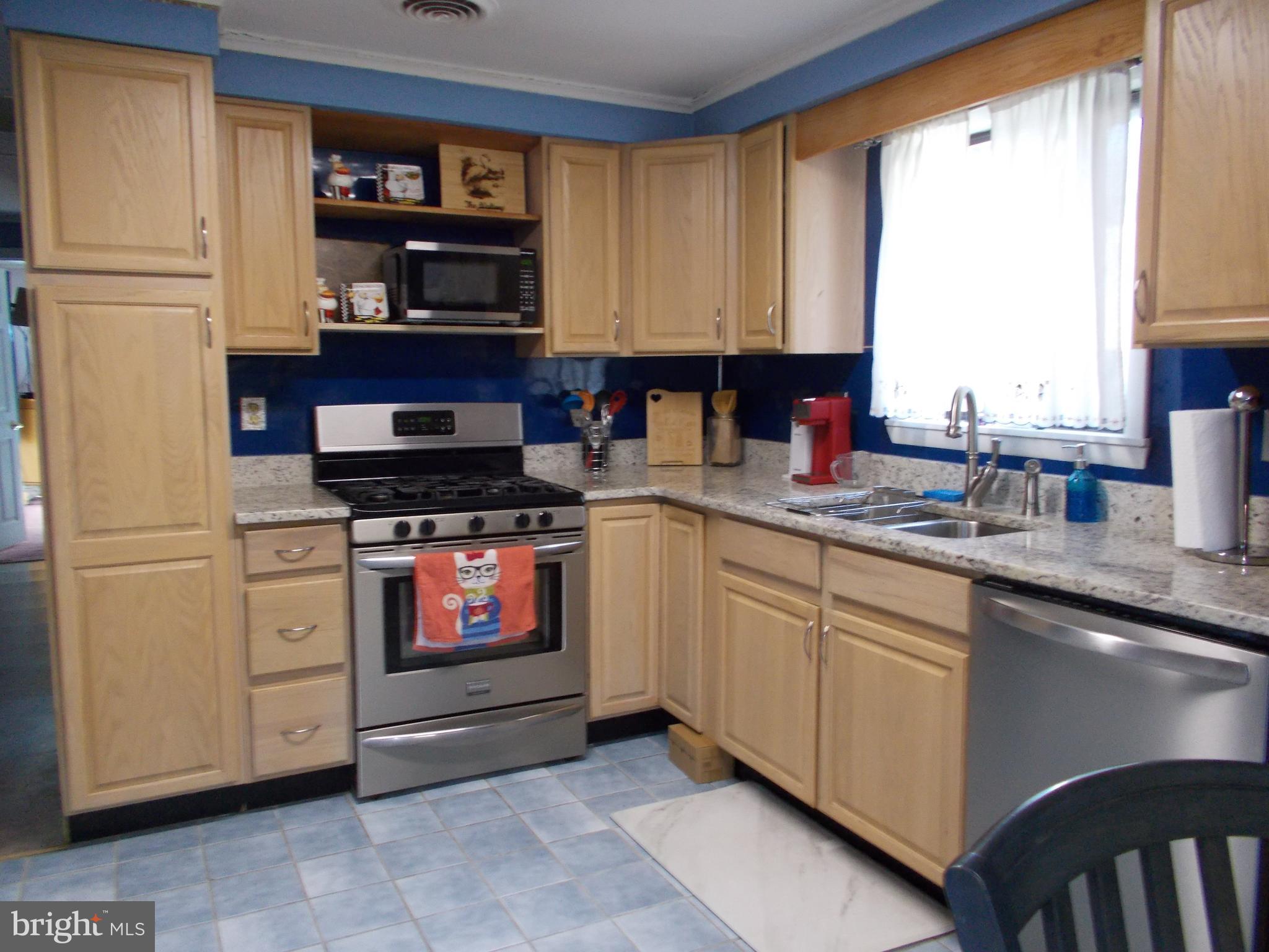 6 Cheyenne Drive Hazleton, PA 18202 - Photo 6 of 20 a kitchen with stainless steel appliances granite countertop a stove a sink and a refrigerator