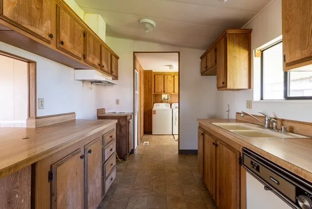 a kitchen with a sink and a window