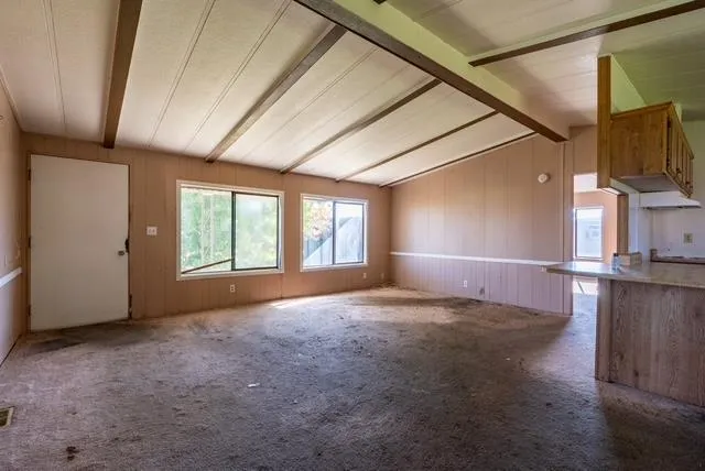 a view of empty room with windows