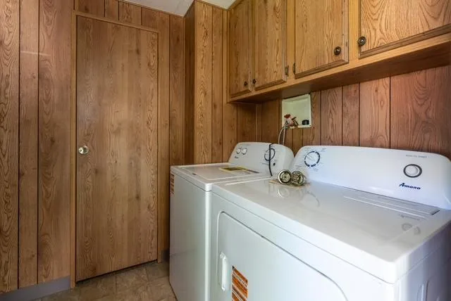 a bathroom with a sink a vanity and a bathtub