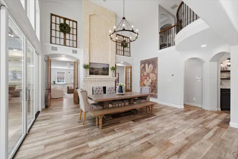 a spacious bathroom with a tub shower and sink