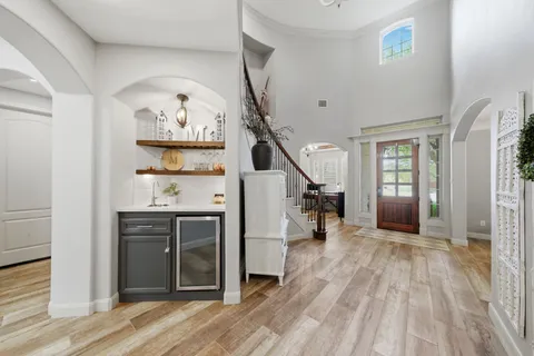 a kitchen with a sink a stove and cabinets