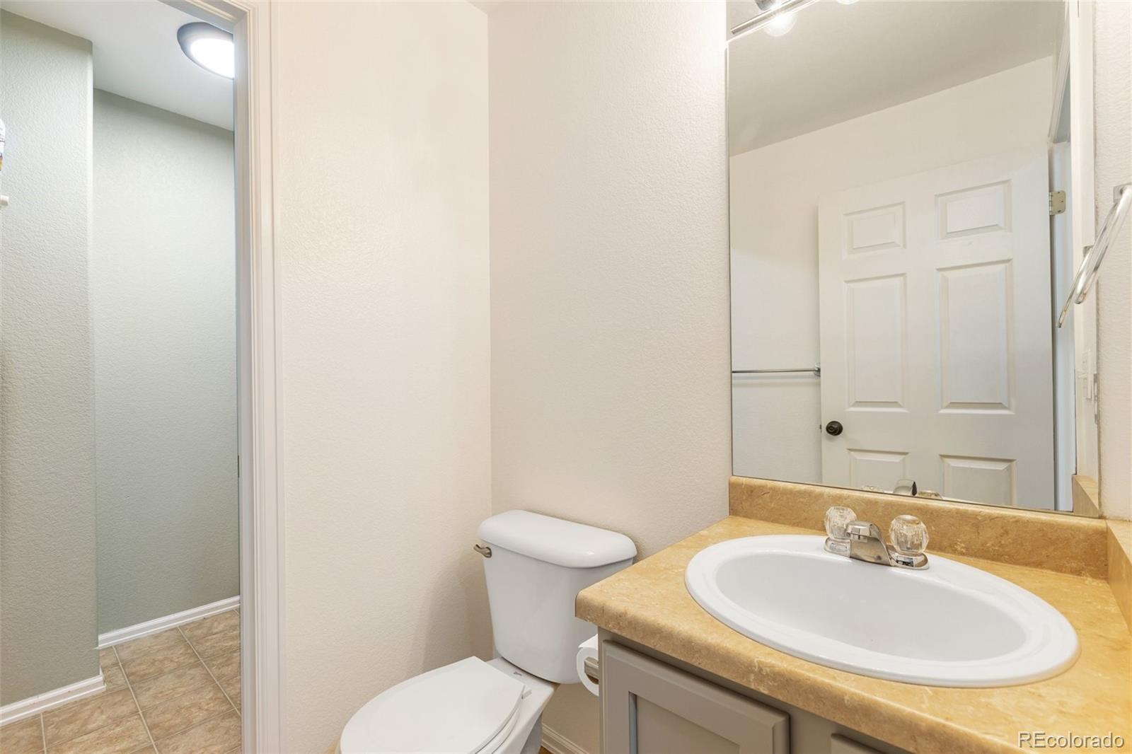 9201 Ballybunion Road Peyton, CO 80831 - Photo 11 of 32 a bathroom with a sink and a toilet