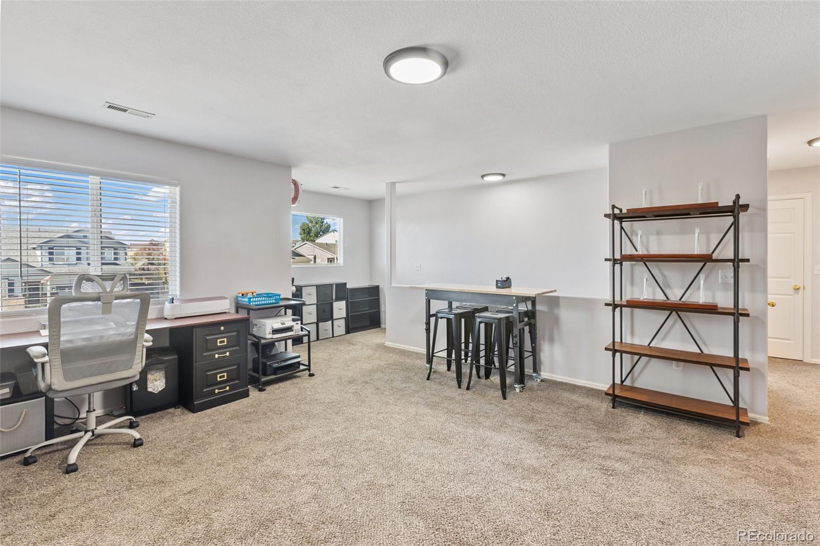9201 Ballybunion Road Peyton, CO 80831 - Photo 16 of 32 a view of a livingroom with furniture and windows