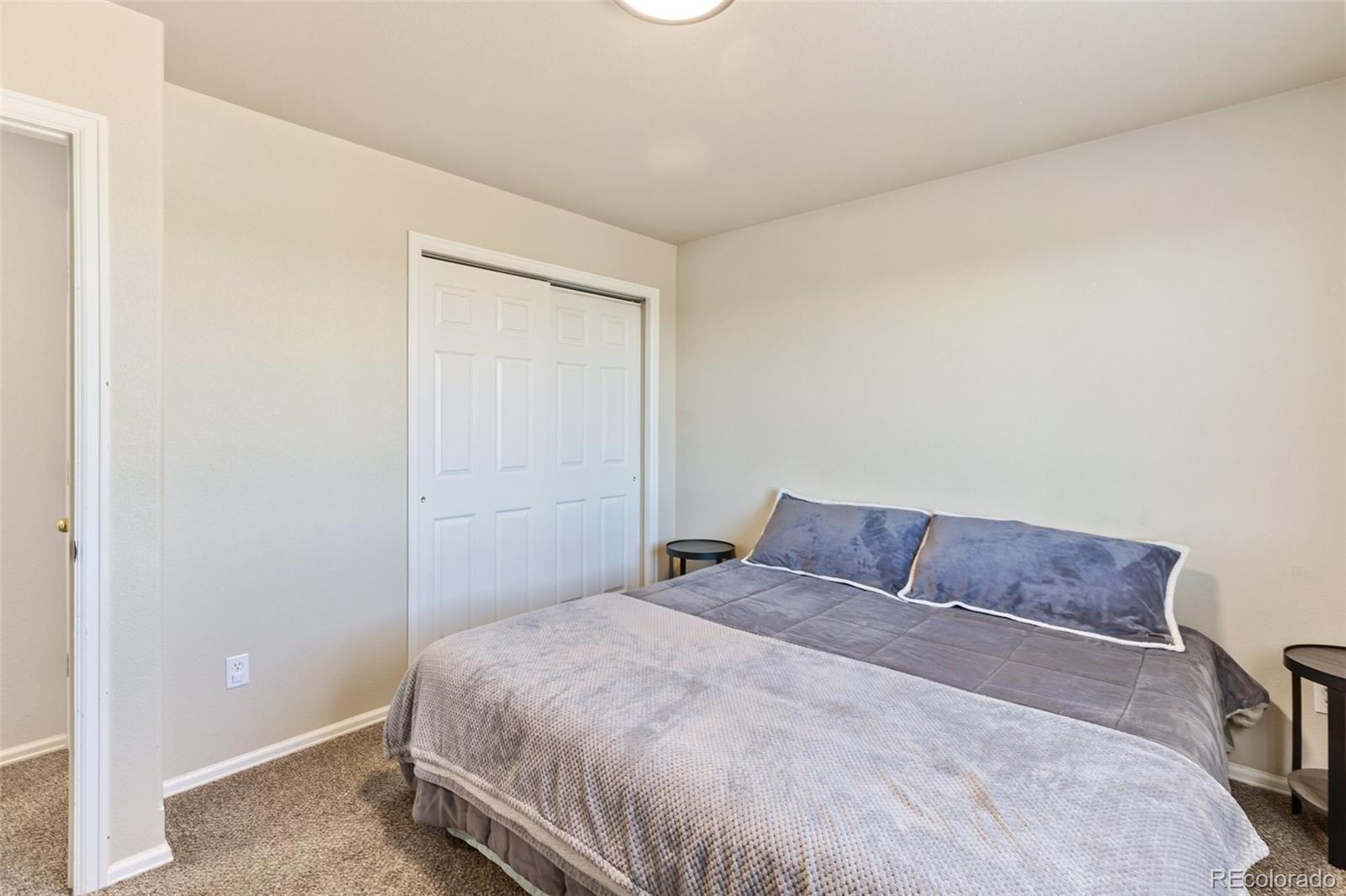 9201 Ballybunion Road Peyton, CO 80831 - Photo 21 of 32 a bedroom with a bed and a window