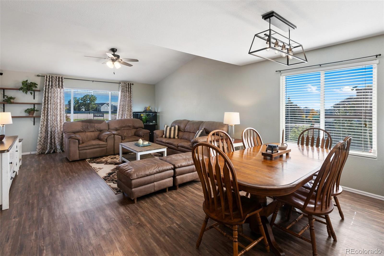 9201 Ballybunion Road Peyton, CO 80831 - Photo 5 of 32 a view of a dining room with furniture window and wooden floor