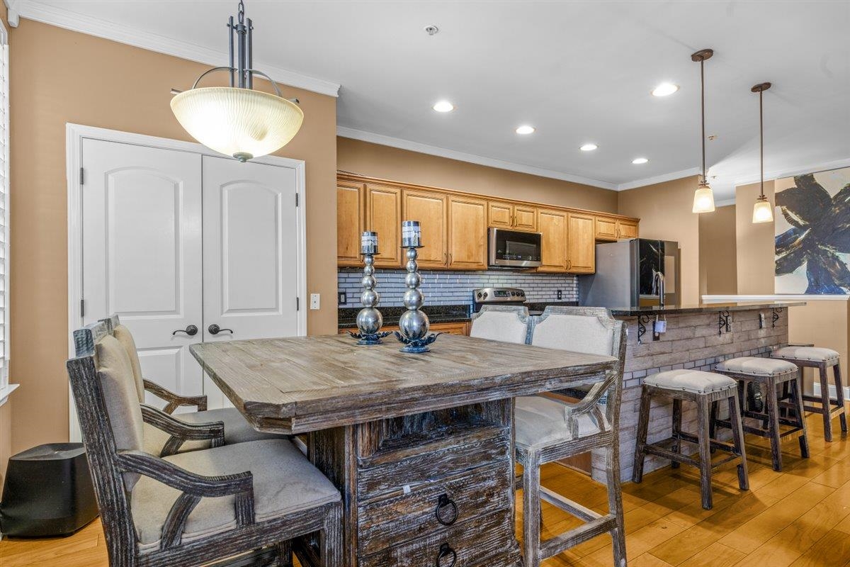 79 Shoemaker Court, Unit 104 Memphis, TN 38103 - Photo 11 of 22 a view of a dining room with furniture