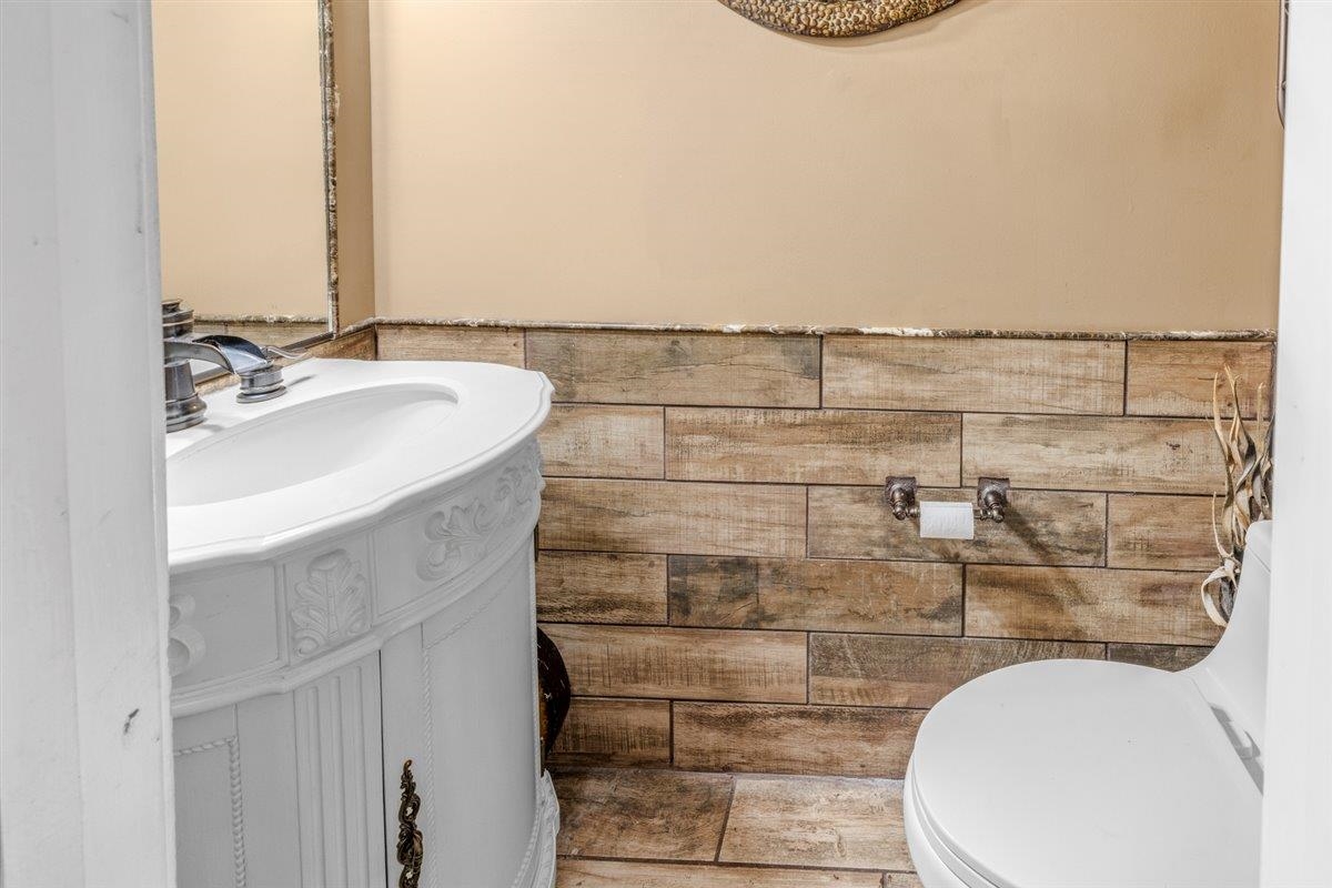 79 Shoemaker Court, Unit 104 Memphis, TN 38103 - Photo 12 of 22 a bathroom with a sink and a mirror