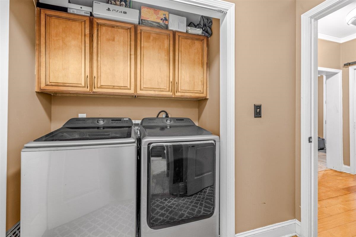 79 Shoemaker Court, Unit 104 Memphis, TN 38103 - Photo 17 of 22 a utility room with washer and dryer