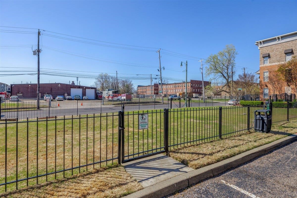 79 Shoemaker Court, Unit 104 Memphis, TN 38103 - Photo 19 of 22 a view of a terrace with a bench