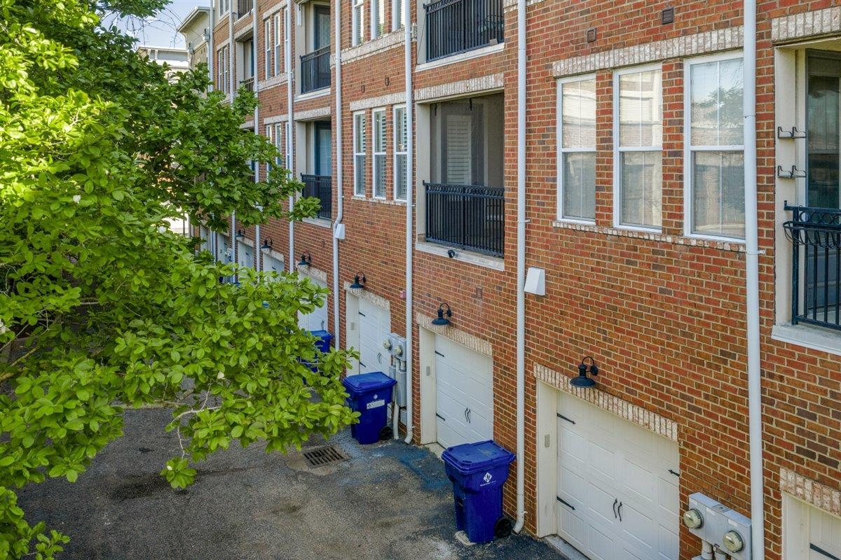 79 Shoemaker Court, Unit 104 Memphis, TN 38103 - Photo 22 of 22 front view of a house with a potted plant and a potted plant