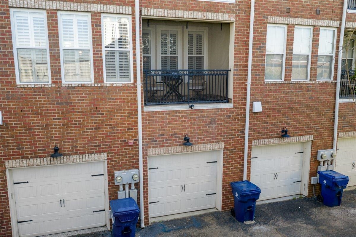 79 Shoemaker Court, Unit 104 Memphis, TN 38103 - Photo 3 of 22 a view of a room that has a chair and storage