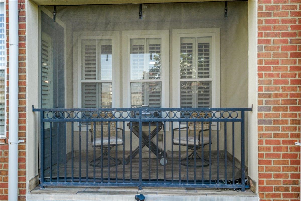 79 Shoemaker Court, Unit 104 Memphis, TN 38103 - Photo 4 of 22 a view of a balcony with chairs