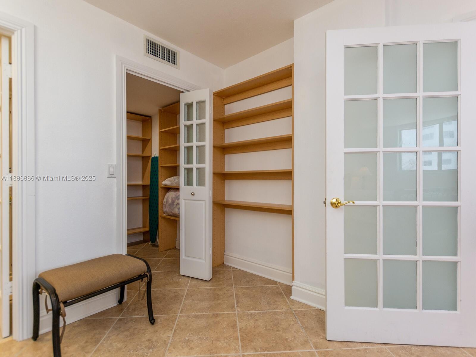 9273 Collins Avenue, Unit 703 Surfside, FL 33154 - Photo 17 of 49 a living room with a furniture and a closet