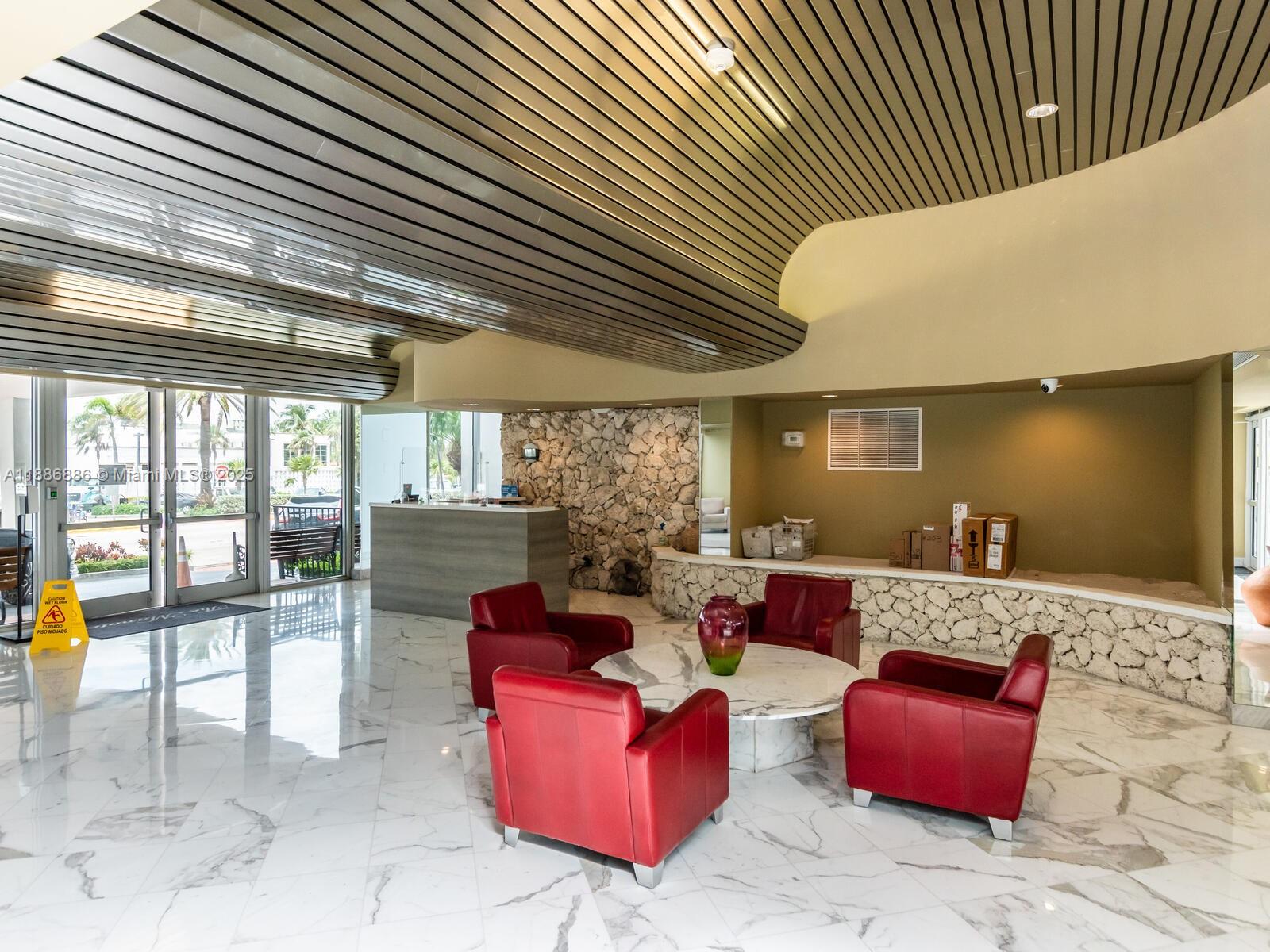 9273 Collins Avenue, Unit 703 Surfside, FL 33154 - Photo 27 of 49 a living room with furniture