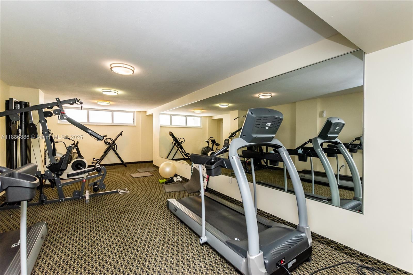 9273 Collins Avenue, Unit 703 Surfside, FL 33154 - Photo 29 of 49 a view of a room with gym equipment