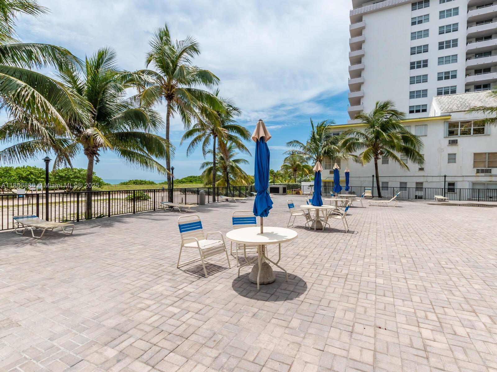 9273 Collins Avenue, Unit 703 Surfside, FL 33154 - Photo 33 of 49 a view of outdoor space with trees