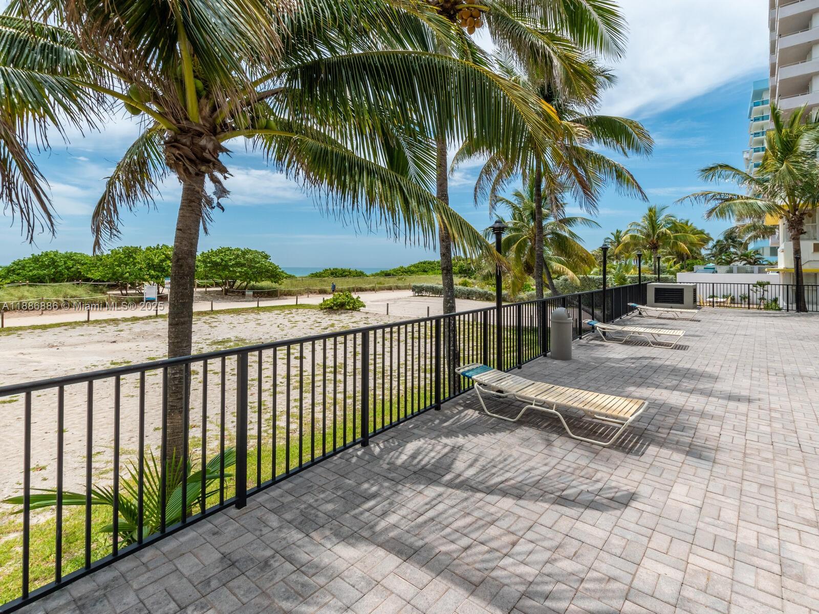 9273 Collins Avenue, Unit 703 Surfside, FL 33154 - Photo 34 of 49 a view of a yard with a patio