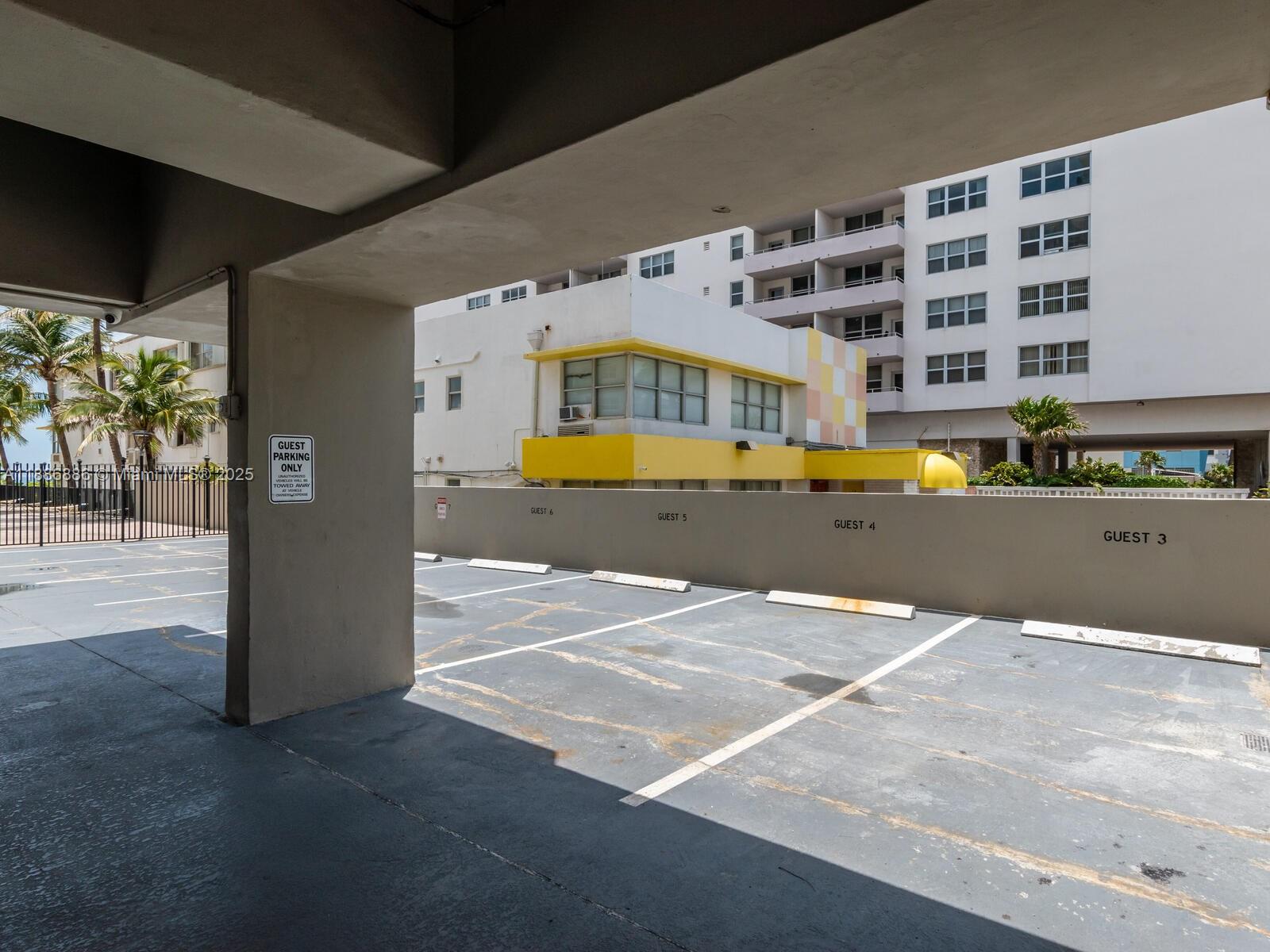 9273 Collins Avenue, Unit 703 Surfside, FL 33154 - Photo 37 of 49 a view of a swimming pool with an outdoor seating