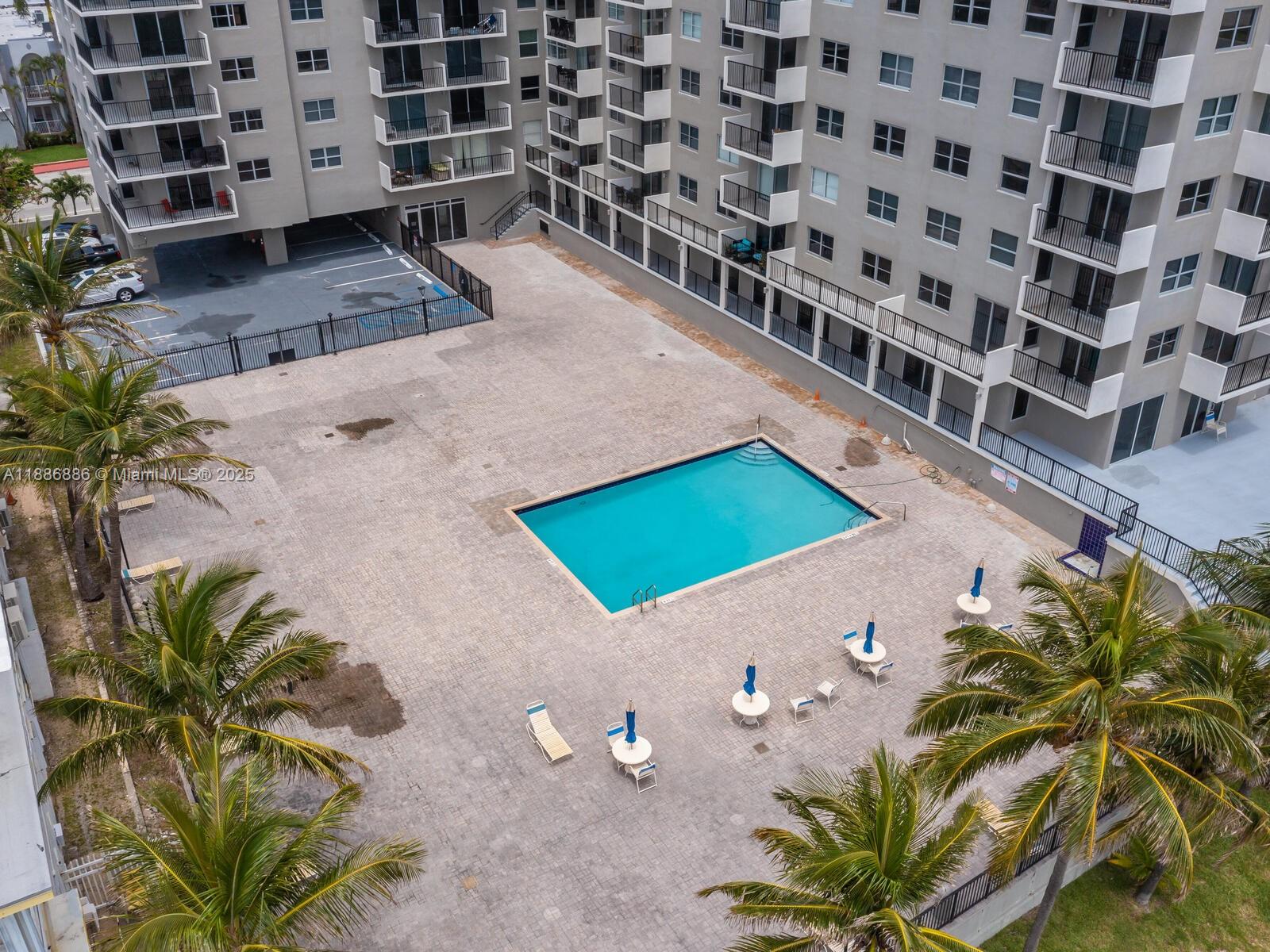 9273 Collins Avenue, Unit 703 Surfside, FL 33154 - Photo 41 of 49 a view of a wooden floor with a potted plant
