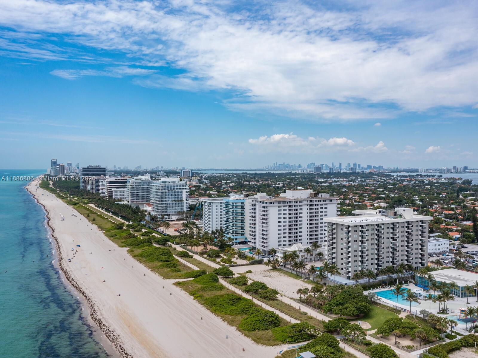 9273 Collins Avenue, Unit 703 Surfside, FL 33154 - Photo 43 of 49 a view of a lake with tall buildings