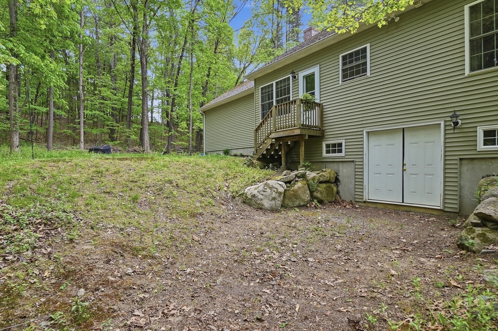 186 Common Street Groton, MA 01450 - Photo 27 of 28 a view of a house with backyard