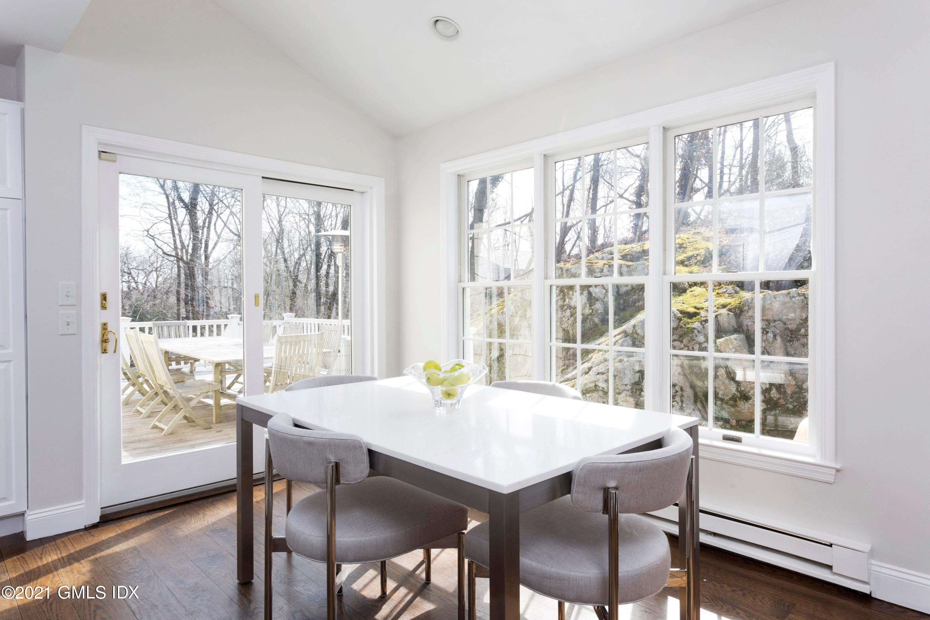 23 Stanwich Road Greenwich, CT 06830 - Photo 11 of 25 a view of a dining room with furniture window and wooden floor