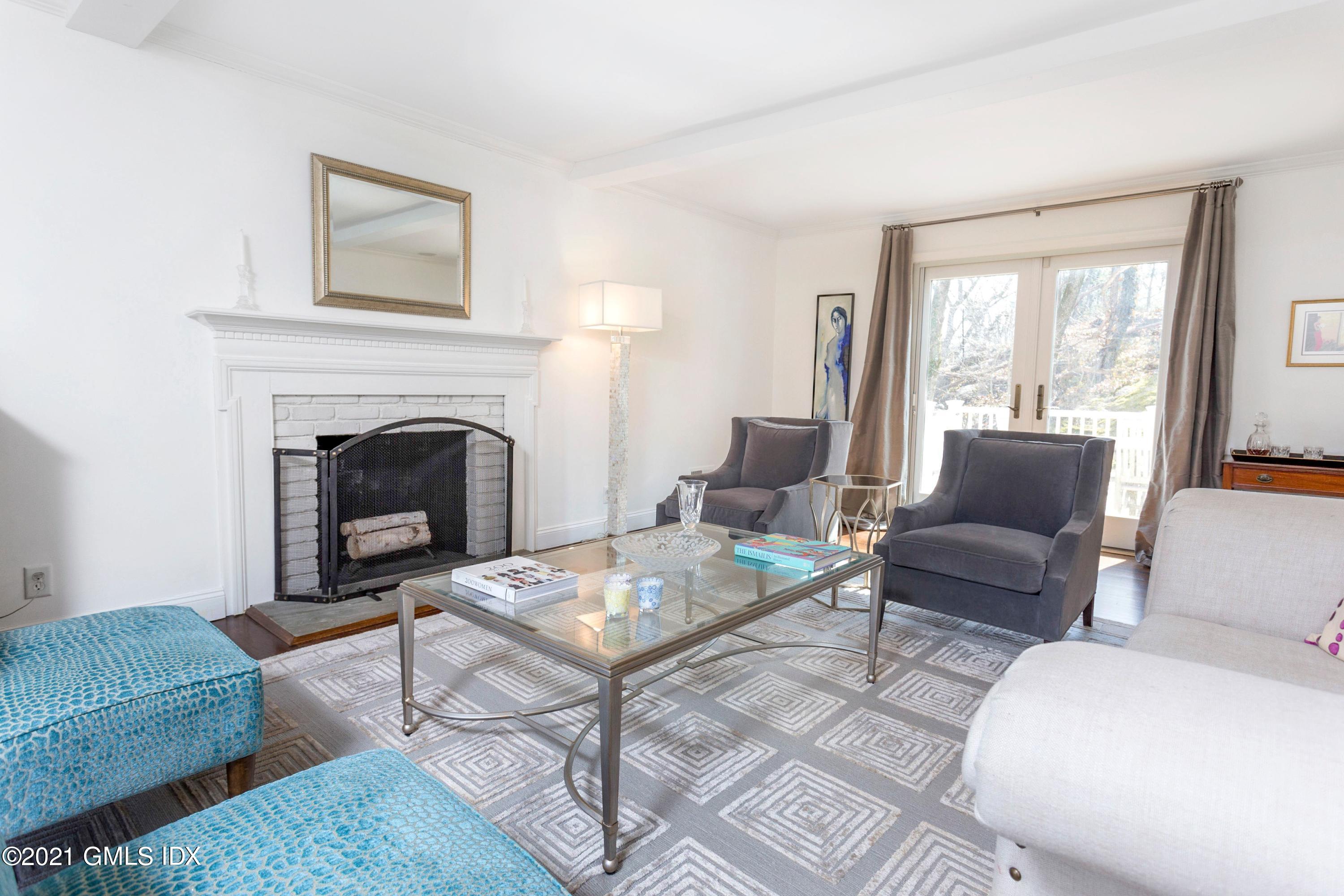 23 Stanwich Road Greenwich, CT 06830 - Photo 14 of 25 a living room with furniture and a fireplace