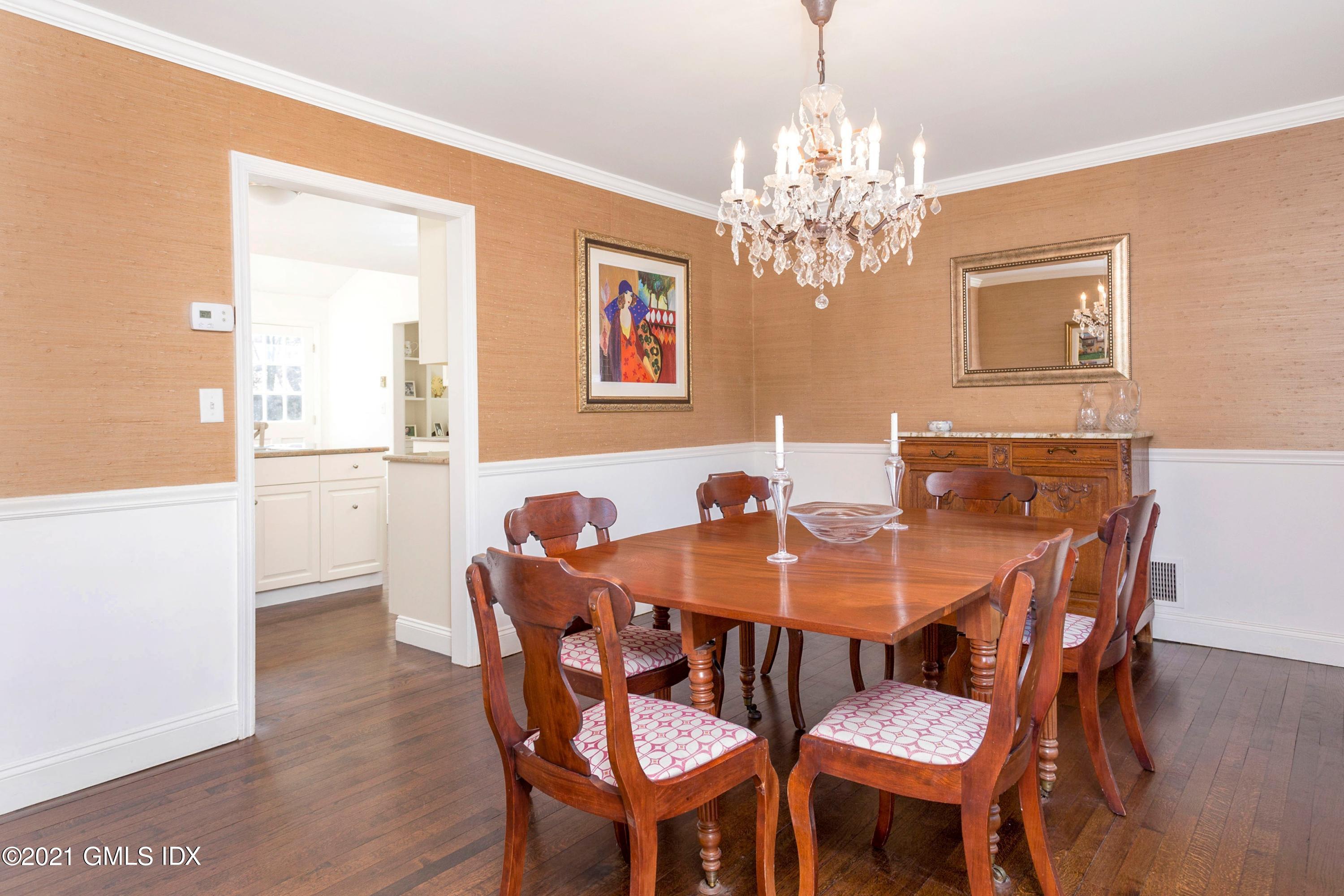 23 Stanwich Road Greenwich, CT 06830 - Photo 15 of 25 a view of a dining room with furniture and chandelier