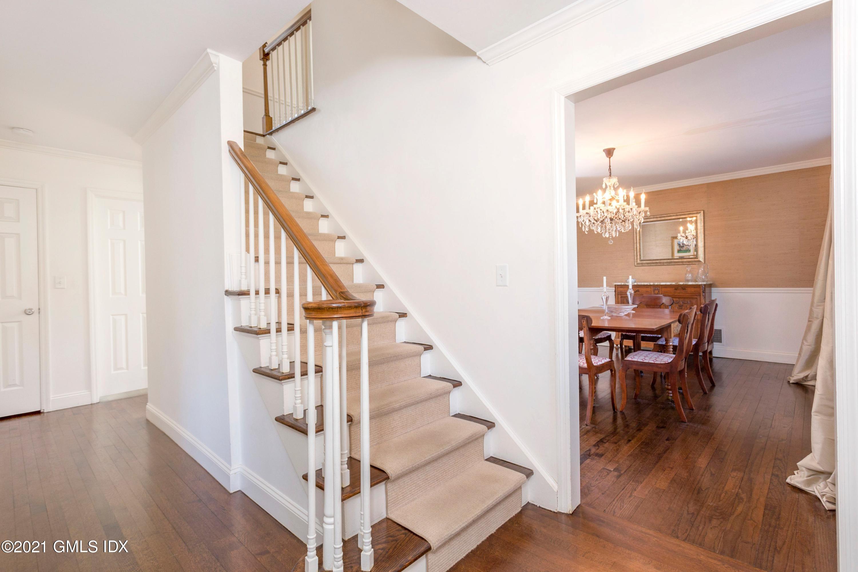 23 Stanwich Road Greenwich, CT 06830 - Photo 16 of 25 a view of entryway and dining room with wooden floor