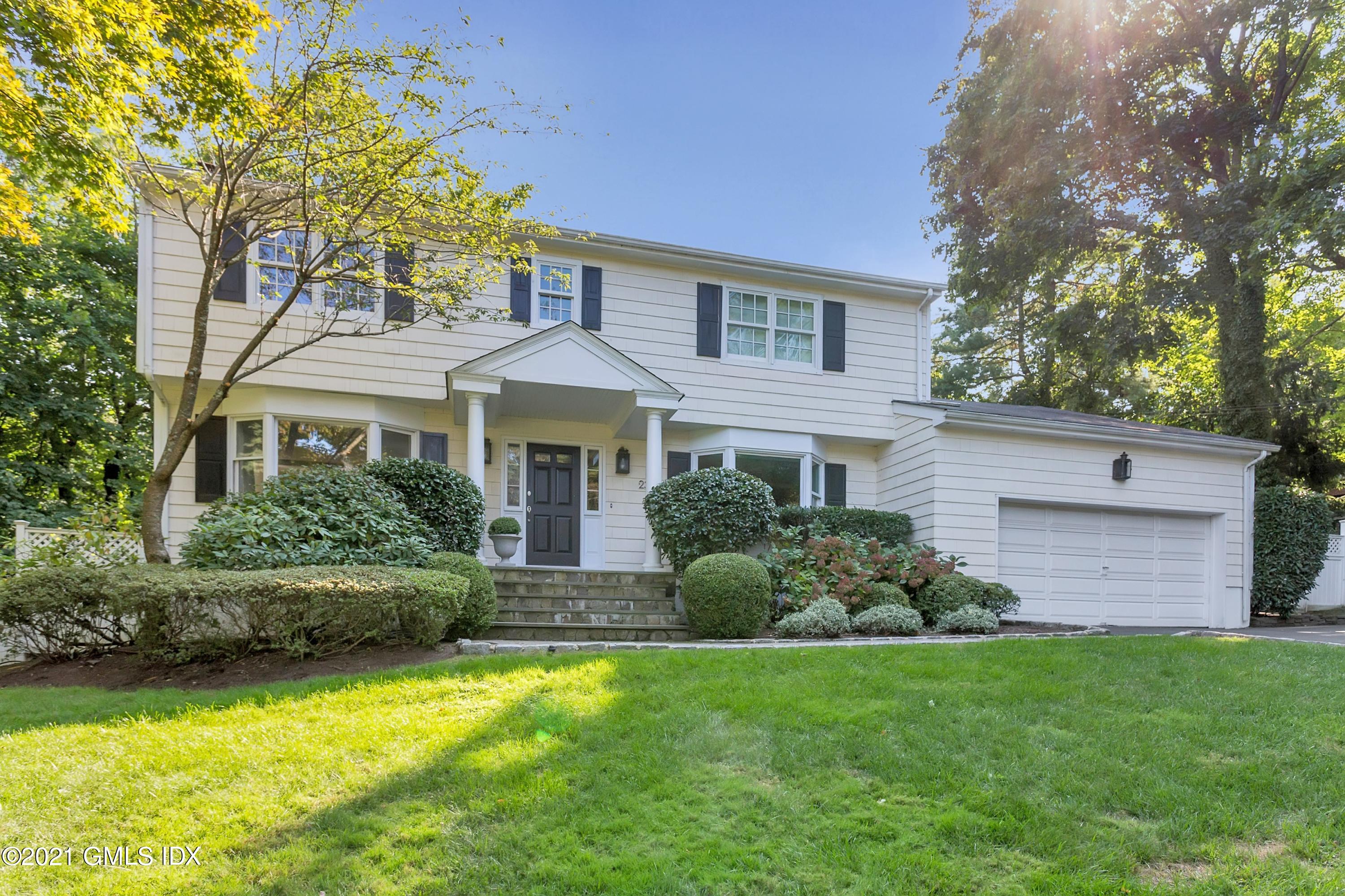 23 Stanwich Road Greenwich, CT 06830 - Photo 3 of 25 a front view of a house with a yard