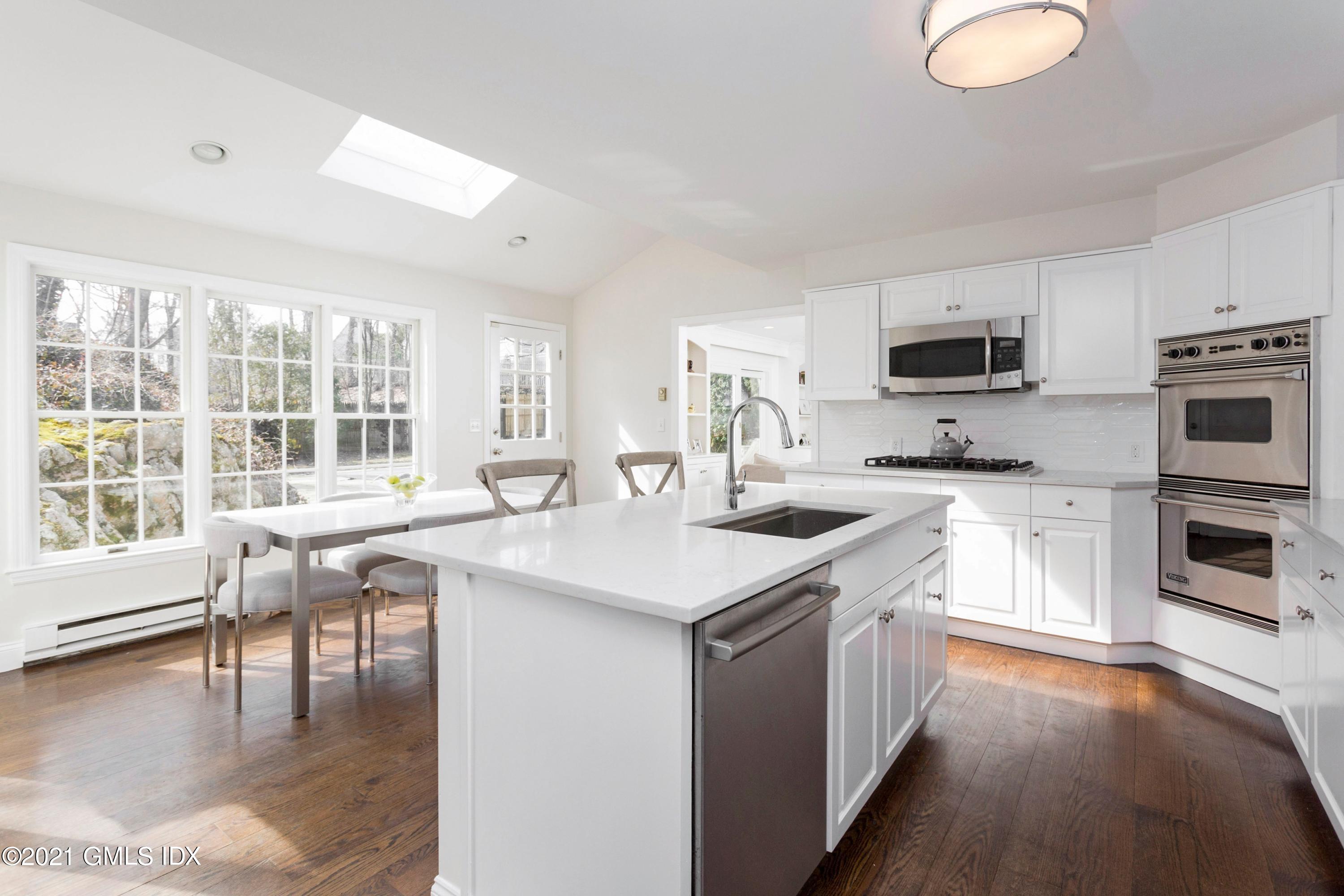 23 Stanwich Road Greenwich, CT 06830 - Photo 6 of 25 a kitchen with a stove a sink and a microwave