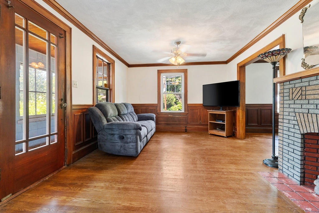 6 Peter Tufts Road Arlington, MA 02474 - Photo 20 of 35 a living room with furniture and a flat screen tv