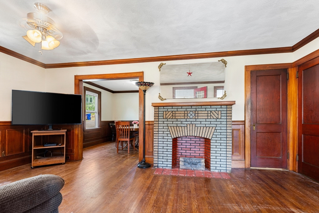 6 Peter Tufts Road Arlington, MA 02474 - Photo 24 of 35 a living room with furniture and a flat screen tv