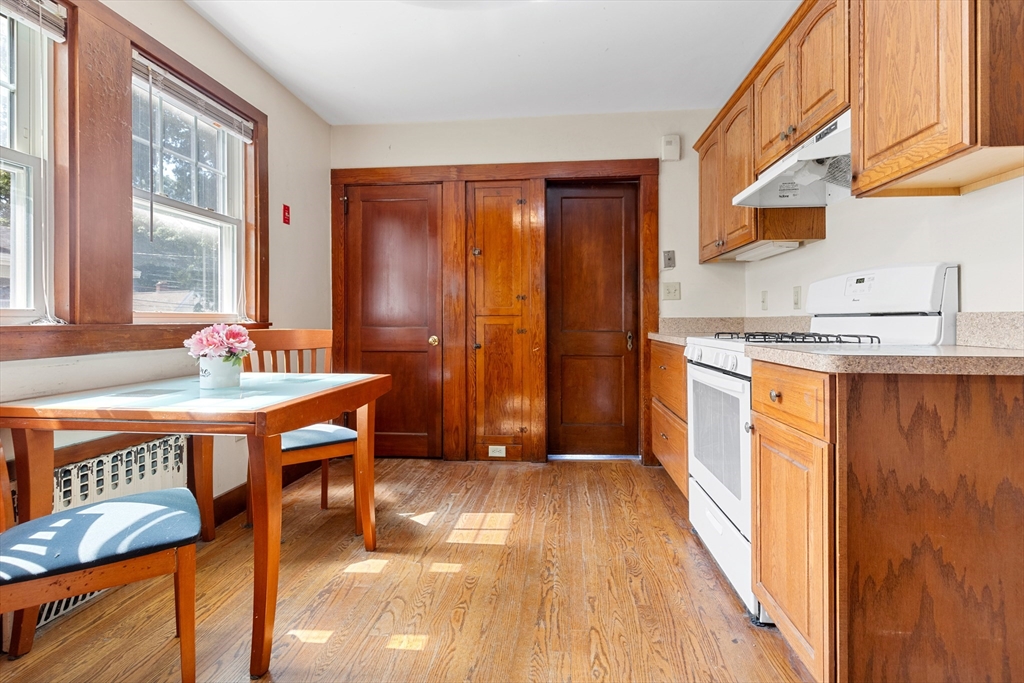 6 Peter Tufts Road Arlington, MA 02474 - Photo 5 of 35 a kitchen with stainless steel appliances granite countertop a stove a sink and a refrigerator