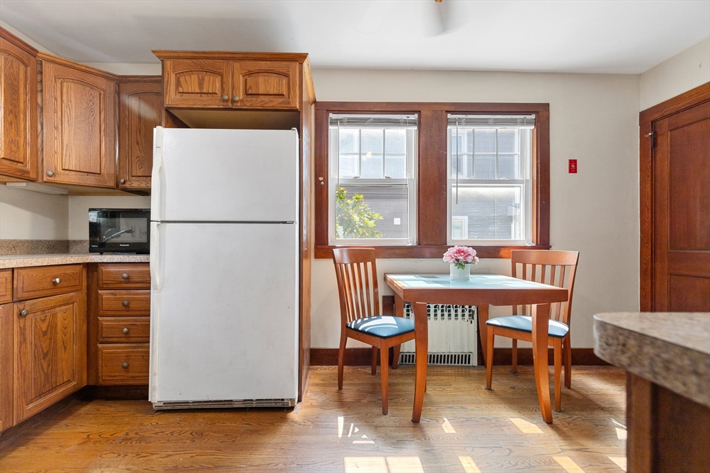 6 Peter Tufts Road Arlington, MA 02474 - Photo 7 of 35 a dinning table chair next to a window