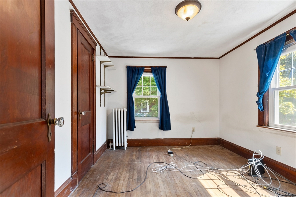 6 Peter Tufts Road Arlington, MA 02474 - Photo 8 of 35 a view of a livingroom with wooden floor and window