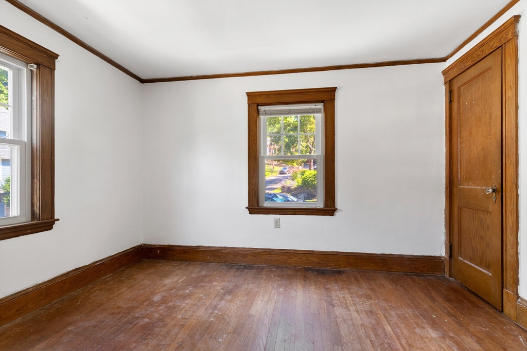 6 Peter Tufts Road Arlington, MA 02474 - Photo 10 of 35 a view of an empty room with wooden floor and a window