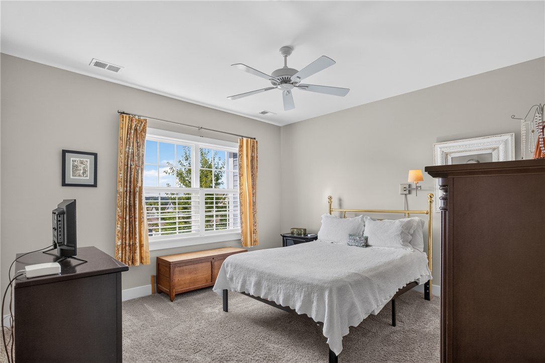 112 Tuttle Street Clemson, SC 29631 - Photo 23 of 46 A tranquil bedroom provides comfort with a window that offers views of the landscape.