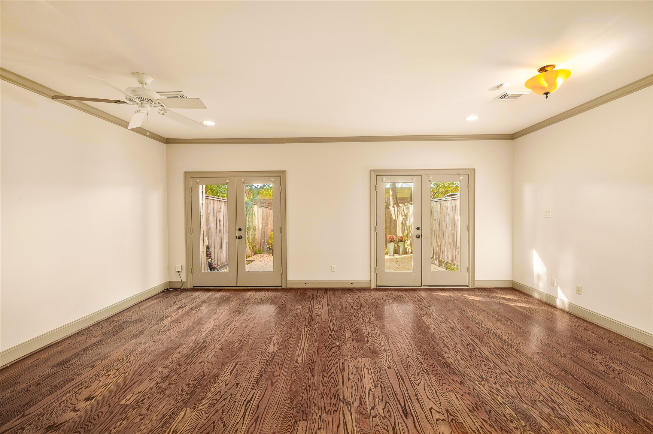 1655 Castle Court Houston, TX 77006 - Photo 13 of 32 The 1st floor bedroom also has a view of the fenced back yard.