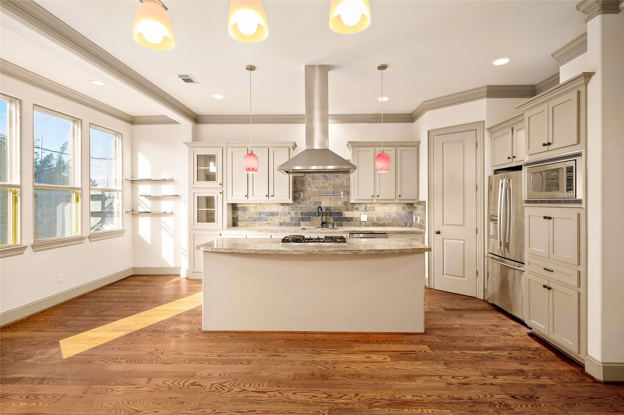 1655 Castle Court Houston, TX 77006 - Photo 18 of 32 It's a social kitchen...if you want it to be. The trees filter the light in the cozy window-side sitting area and the counter is perfect for bar stools. You can always step out to the adjacent balcony too.