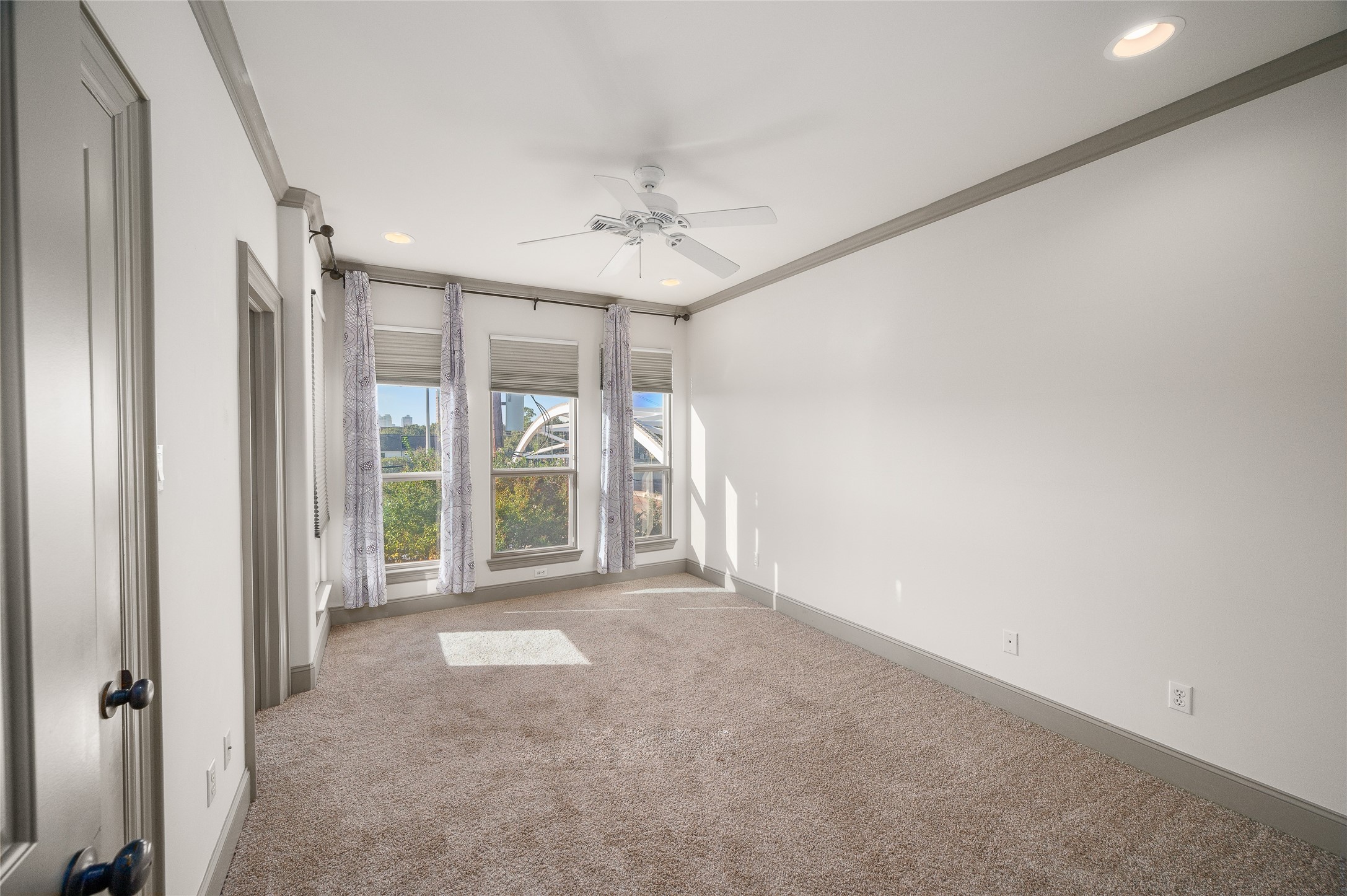 1655 Castle Court Houston, TX 77006 - Photo 23 of 32 The secondary bedroom on the 3rd floor has a walk-in closet and en suite bath. Ceiling fan, recessed lighting and new carpet.