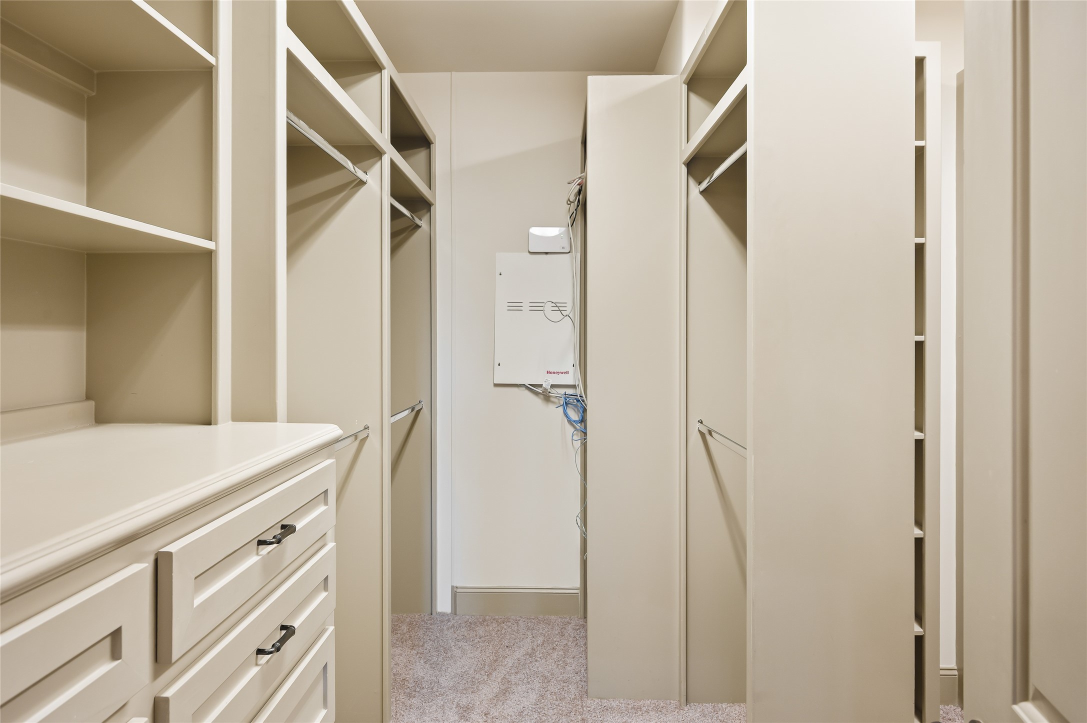 1655 Castle Court Houston, TX 77006 - Photo 28 of 32 We know it's all about the closet and you can't go wrong with good design. Built in shelving and drawers and a nice division in case it's shared. This is half of it.