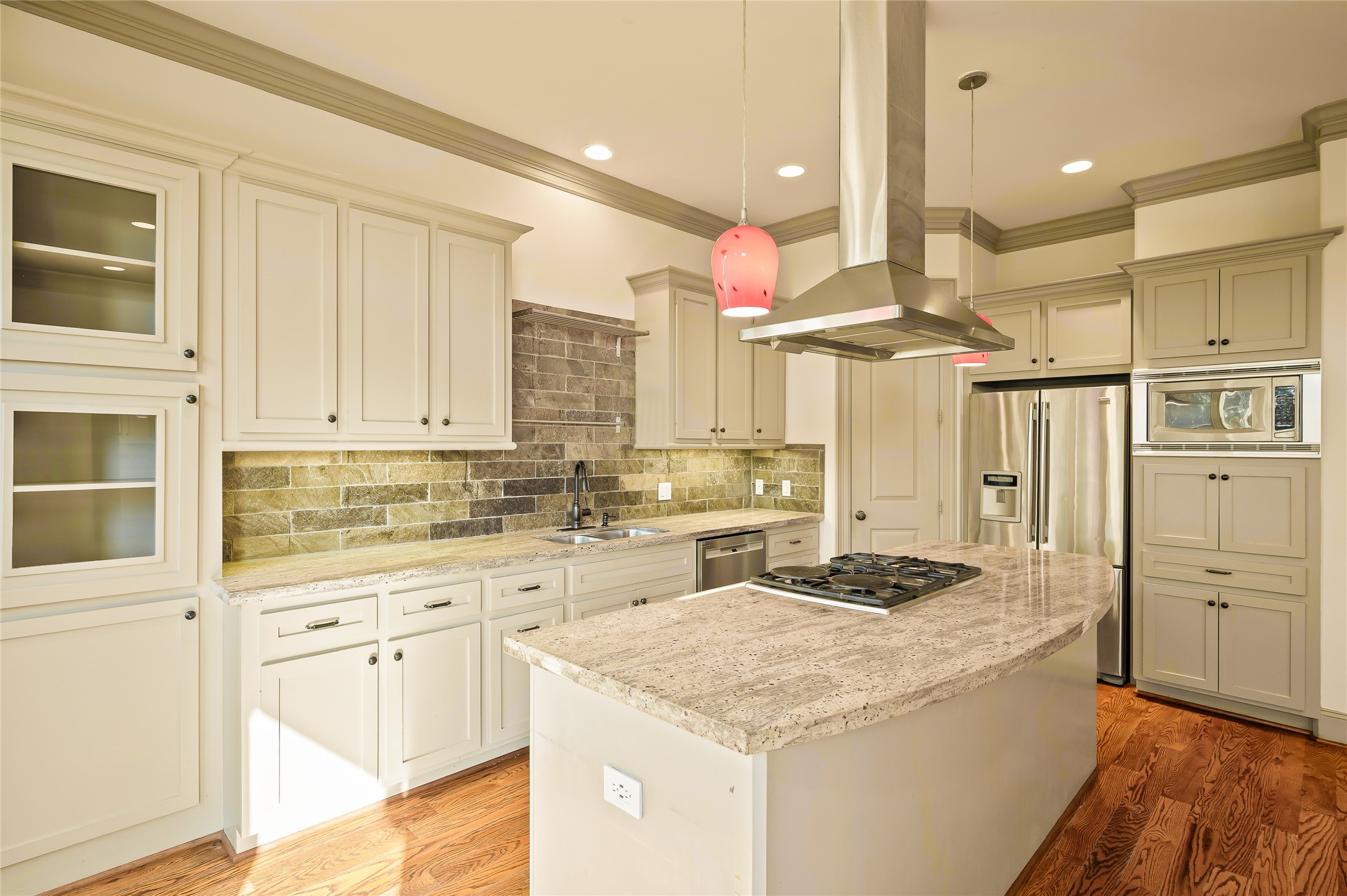 1655 Castle Court Houston, TX 77006 - Photo 3 of 32 You'll love the walk-in pantry, Shaker style cabinetry including stylish glass-front cabinets. The counter space is perfectly placed so multiple "chefs" can join you while you cook.