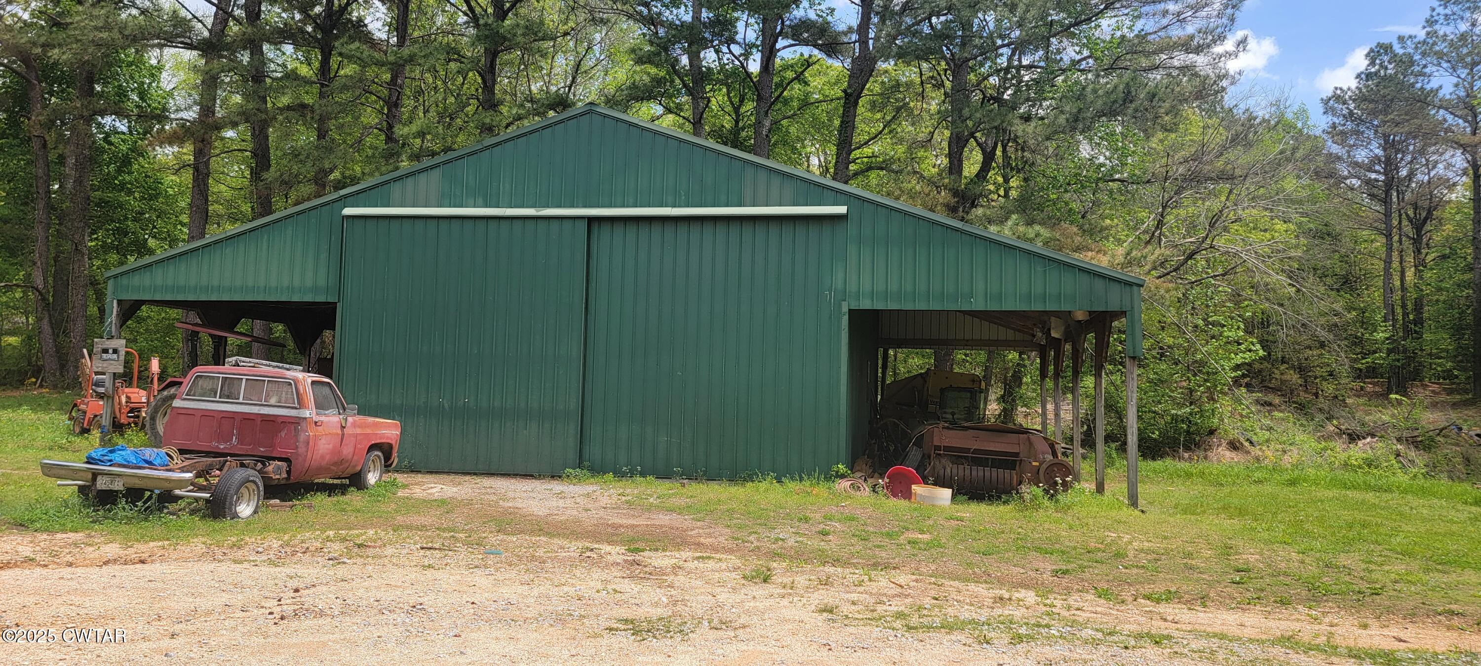 620 Hamilton Road Lexington, TN 38351 - Photo 4 of 7 a view of a small house in the back yard
