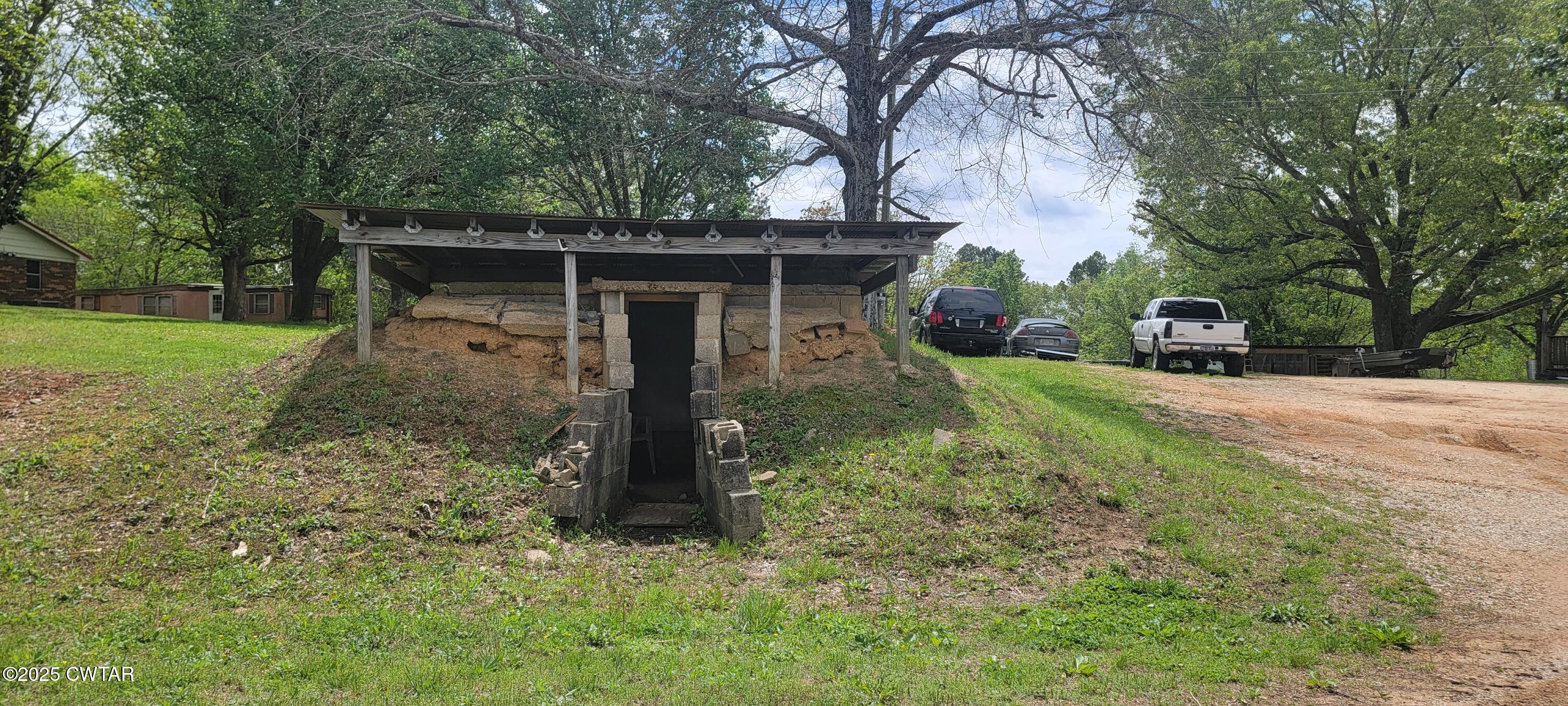 620 Hamilton Road Lexington, TN 38351 - Photo 5 of 7 a view of a house with a yard