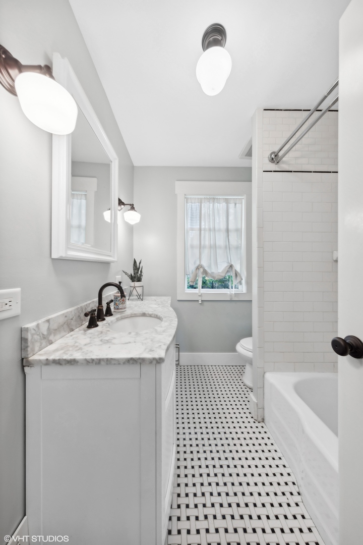 410 Mills Street Hinsdale, IL 60521 - Photo 16 of 22 a bathroom with a sink a toilet a mirror and shower